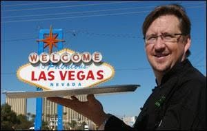 Todd Clore holding a Welcome to Fabulous Las Vegas sign